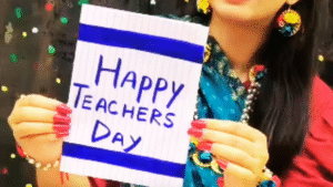 A person holding a handmade greeting card that says "Happy Teacher's Day," showcasing creative and personal Teacher's Day gift ideas.